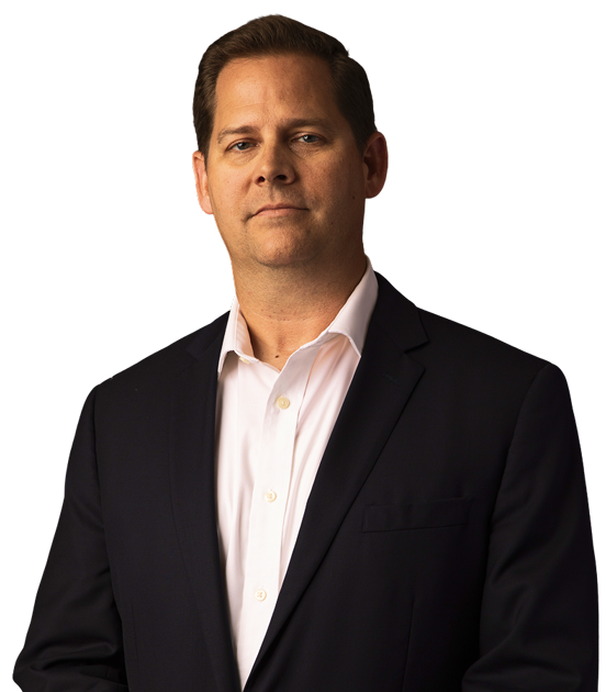 Jason in formal suit and facing the camera